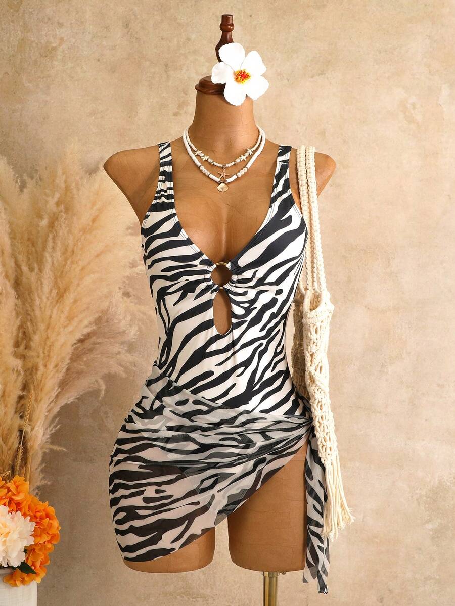 Women's black floral print plunge neck one-piece swimsuit featuring cut-out detail paired with a matching knee-length mesh cover-up skirt