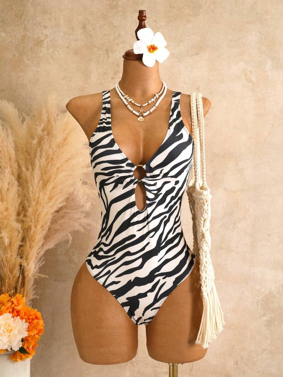 Women's black floral print plunge neck one-piece swimsuit featuring cut-out detail paired with a matching knee-length mesh cover-up skirt