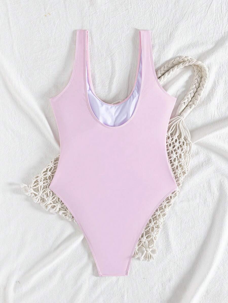 Women's solid color one-piece swimsuit featuring a backless scoop neck design and high cut fit