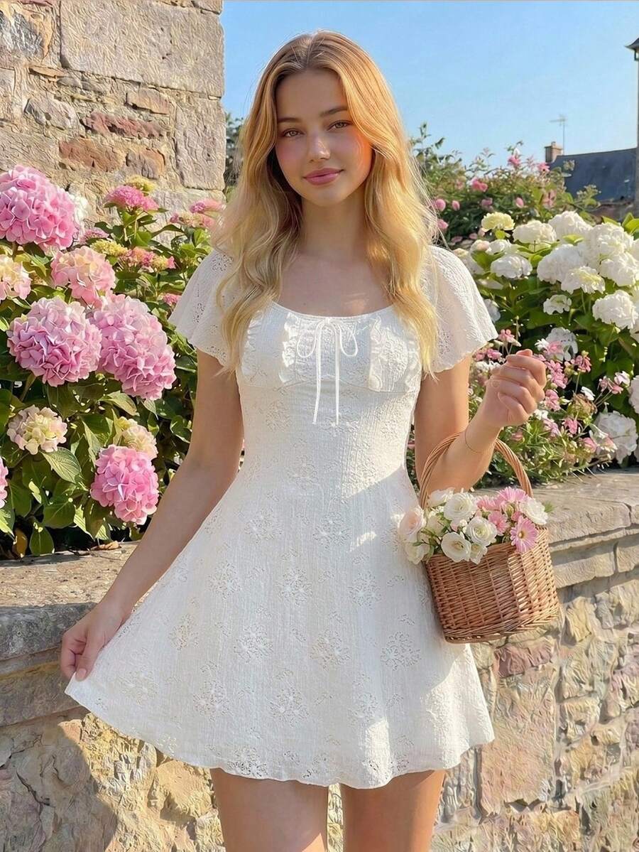 Teen girls red floral print A-line party dress featuring short puff sleeves, square neckline, ruched bust, and contrast lace details.
