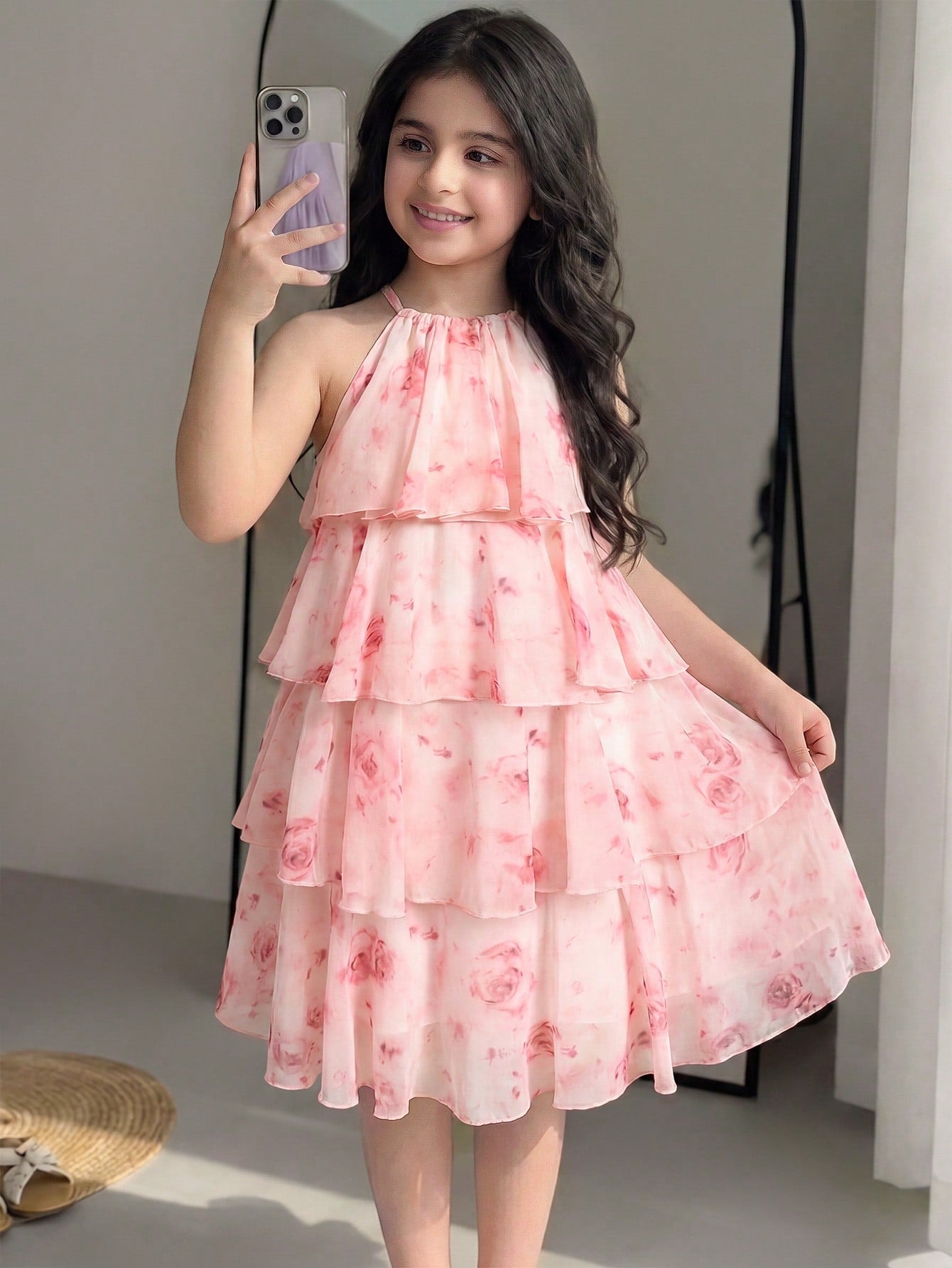 Apricot all-over floral print midi dress for tween girls featuring a sleeveless V-neckline, high waist, button details, and tiered A-line skirt.