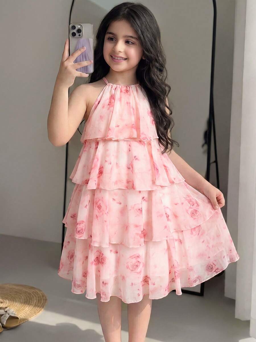 Apricot all-over floral print midi dress for tween girls featuring a sleeveless V-neckline, high waist, button details, and tiered A-line skirt.