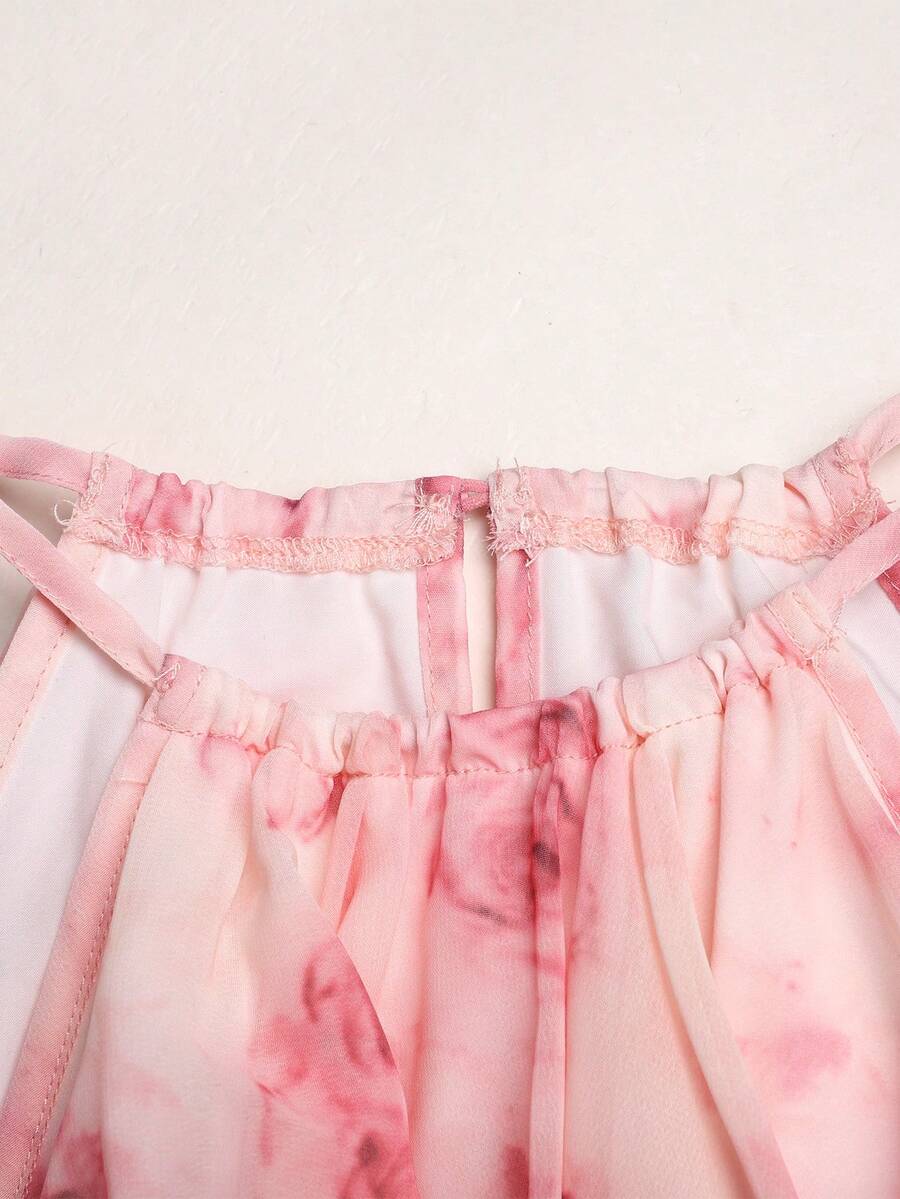 Apricot all-over floral print midi dress for tween girls featuring a sleeveless V-neckline, high waist, button details, and tiered A-line skirt.