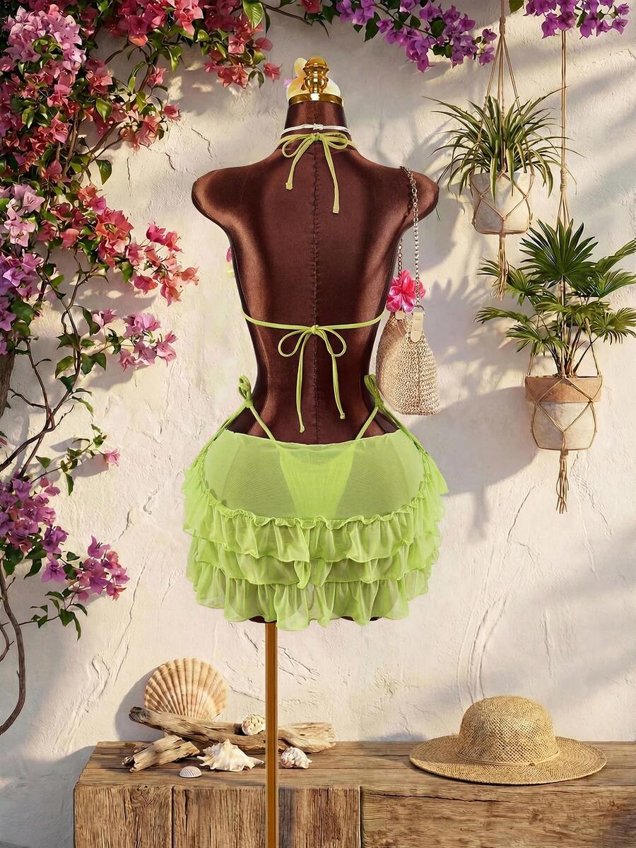 Women's 3-piece blue bikini swimwear set featuring a crop top with 3D rose accents, tie back detail, spaghetti straps, and tie-side bottoms.