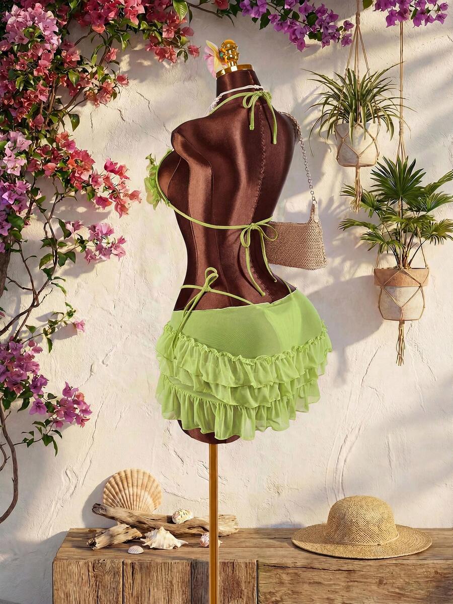 Women's 3-piece blue bikini swimwear set featuring a crop top with 3D rose accents, tie back detail, spaghetti straps, and tie-side bottoms.