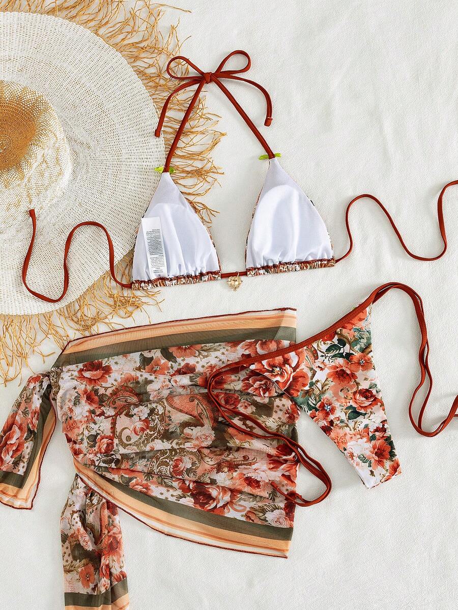 Women's 3-piece pink floral print bikini set featuring a wireless halter top with removable padding and matching tie-side swim bottoms.