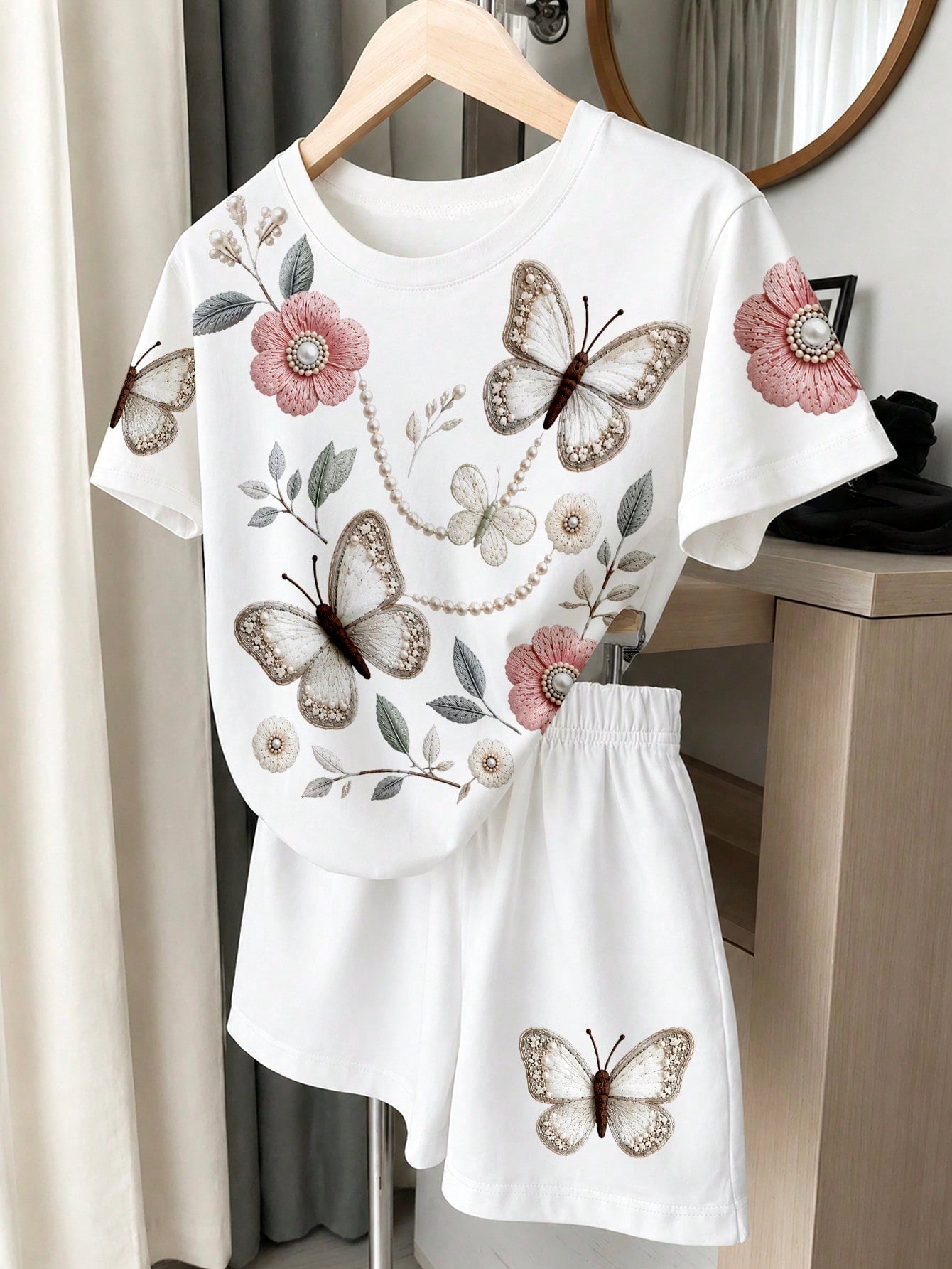 Tween girls two-piece green summer outfit featuring a fruit print short sleeve round neck t-shirt and matching track shorts with pockets.