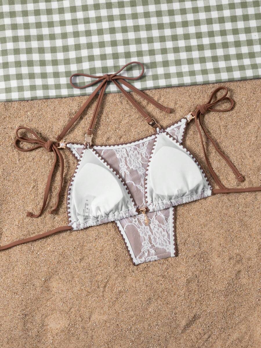 Women's triangle bikini set with contrast lace wireless bra top and ultra high waist tie side bottoms.