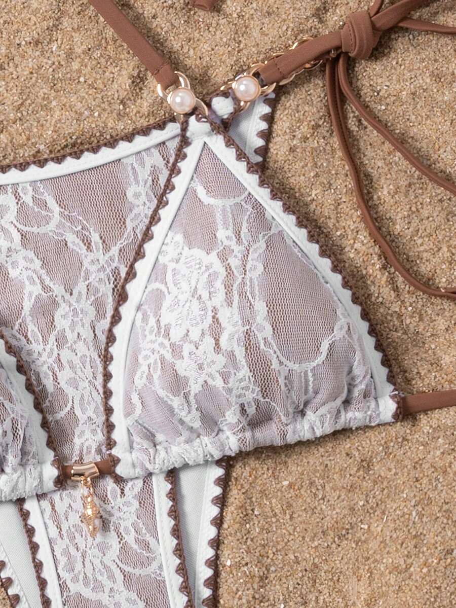 Women's triangle bikini set with contrast lace wireless bra top and ultra high waist tie side bottoms.