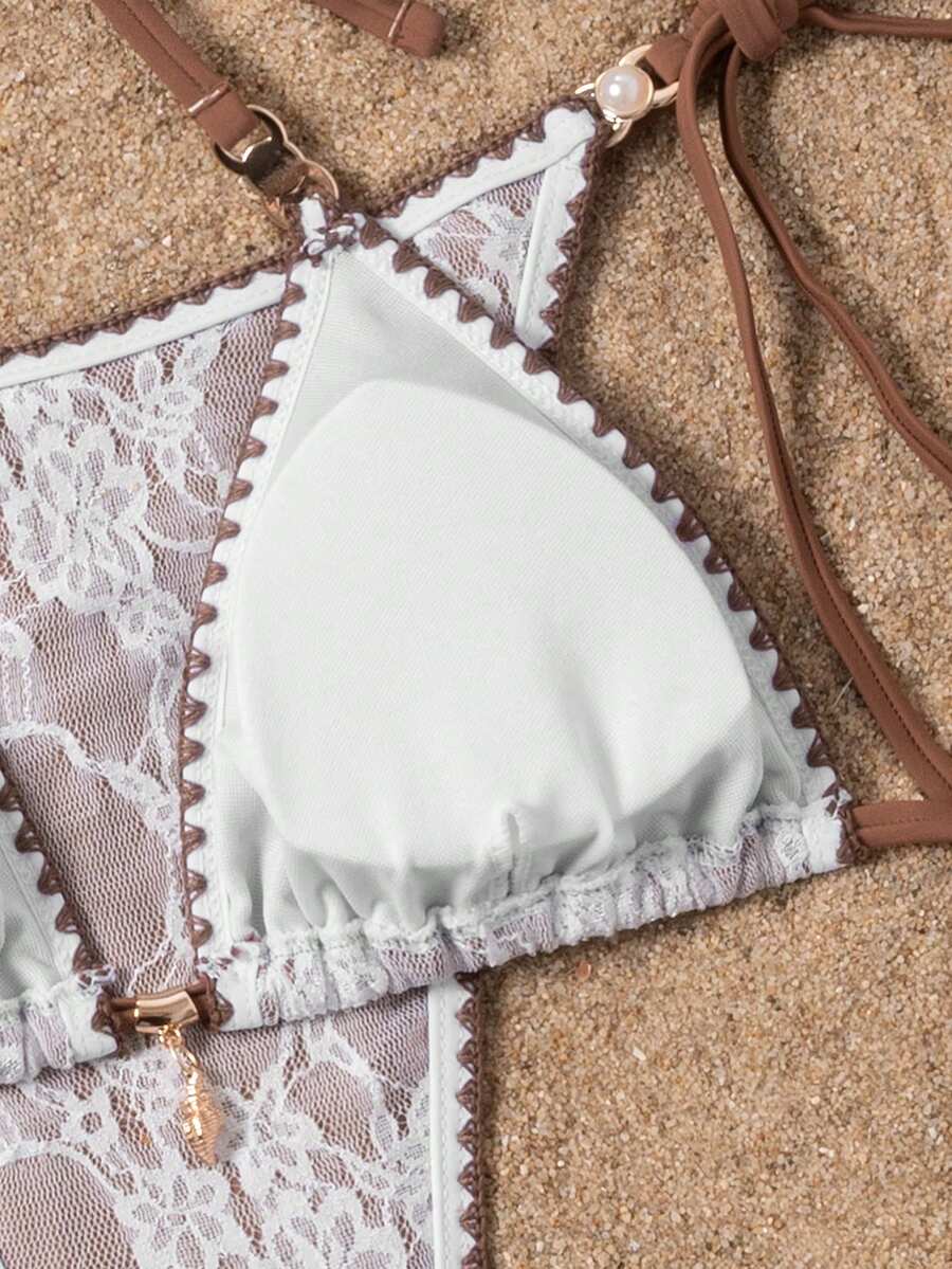 Women's triangle bikini set with contrast lace wireless bra top and ultra high waist tie side bottoms.