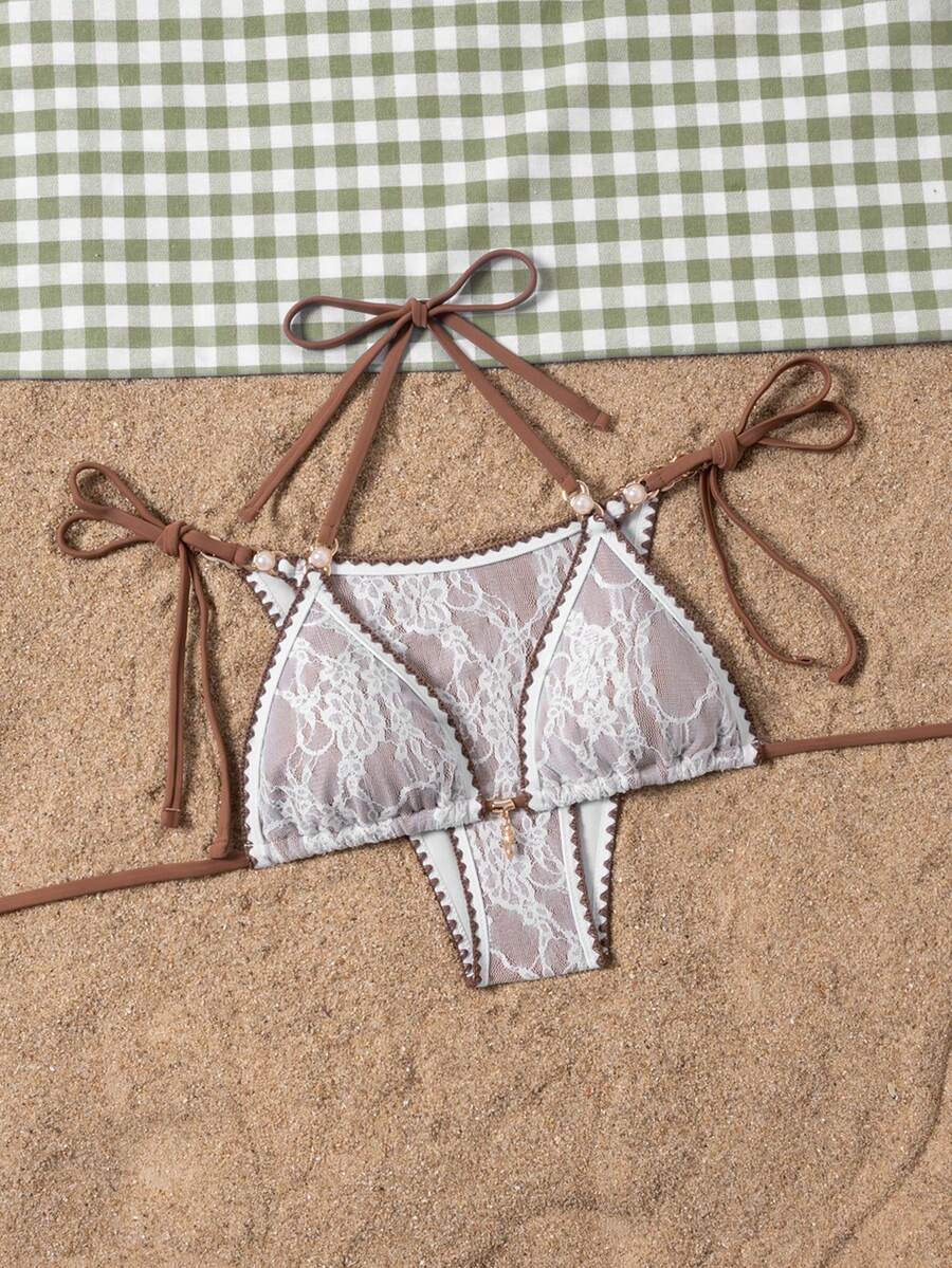 Women's triangle bikini set with contrast lace wireless bra top and ultra high waist tie side bottoms.