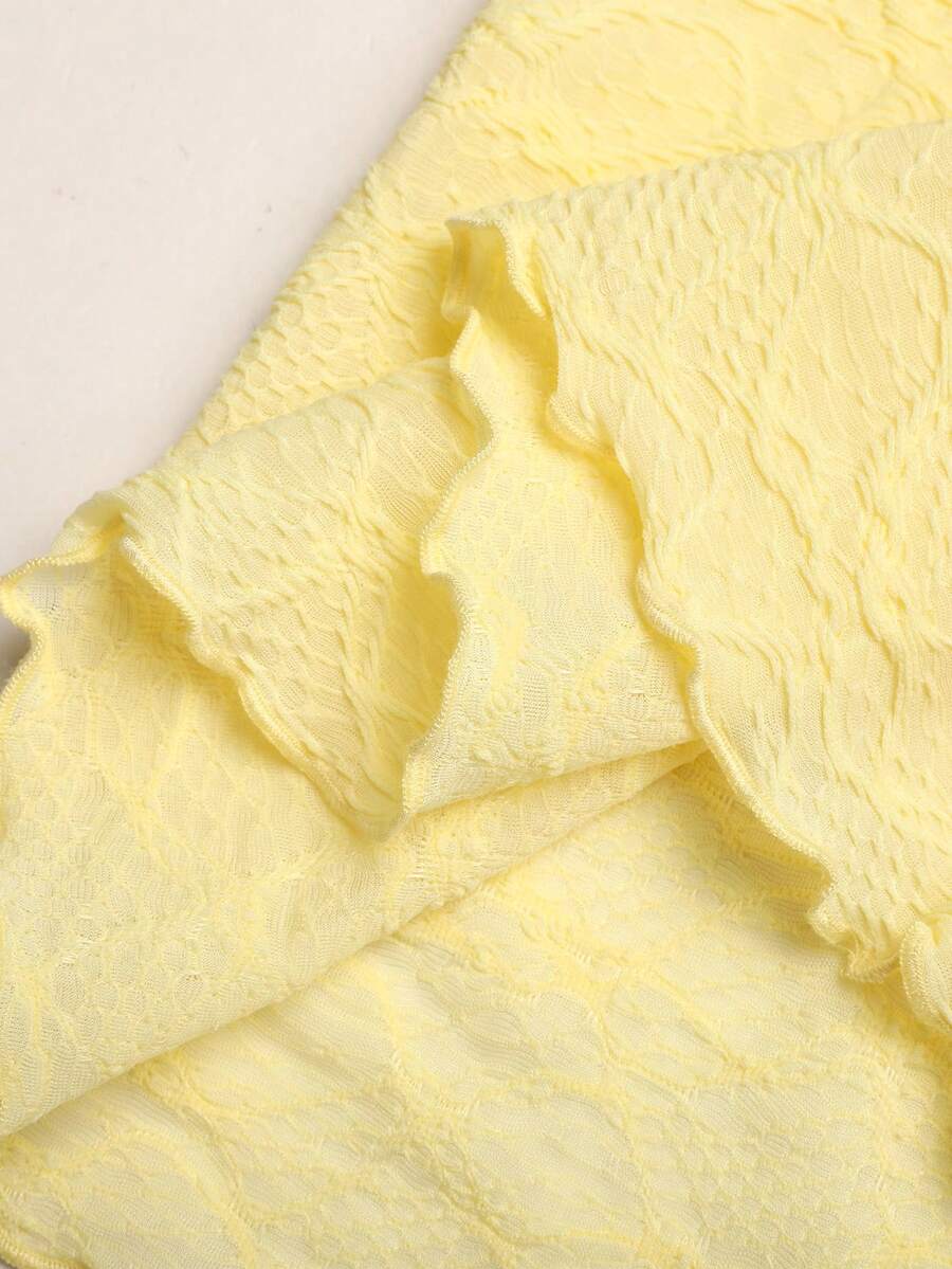 Tween girl yellow long halter dress with textured jacquard knit, sleeveless slim fit cami design, natural waist, straight hem, and lined non-sheer finish for vacation or party wear.