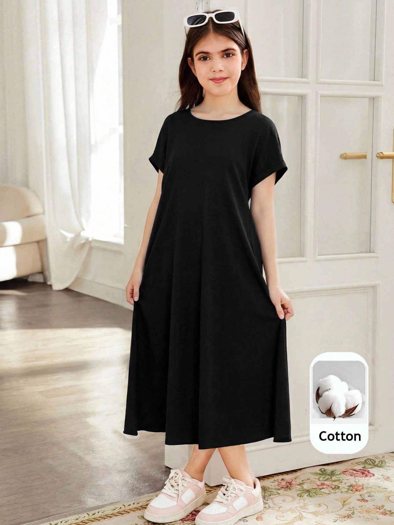 Tween girls casual black A-line long dress featuring short sleeves, a round neckline, and a decorative front bow with contrast lace trim.