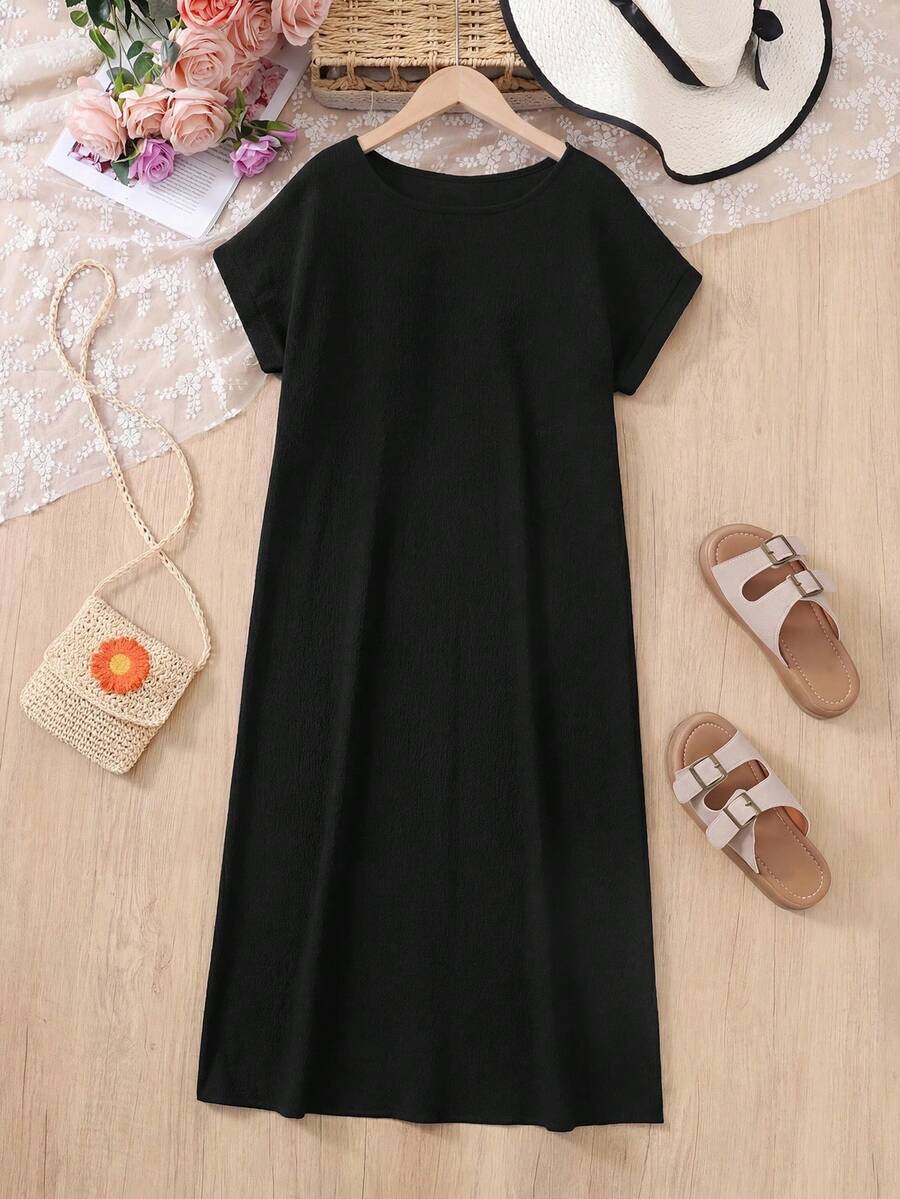 Tween girls casual black A-line long dress featuring short sleeves, a round neckline, and a decorative front bow with contrast lace trim.