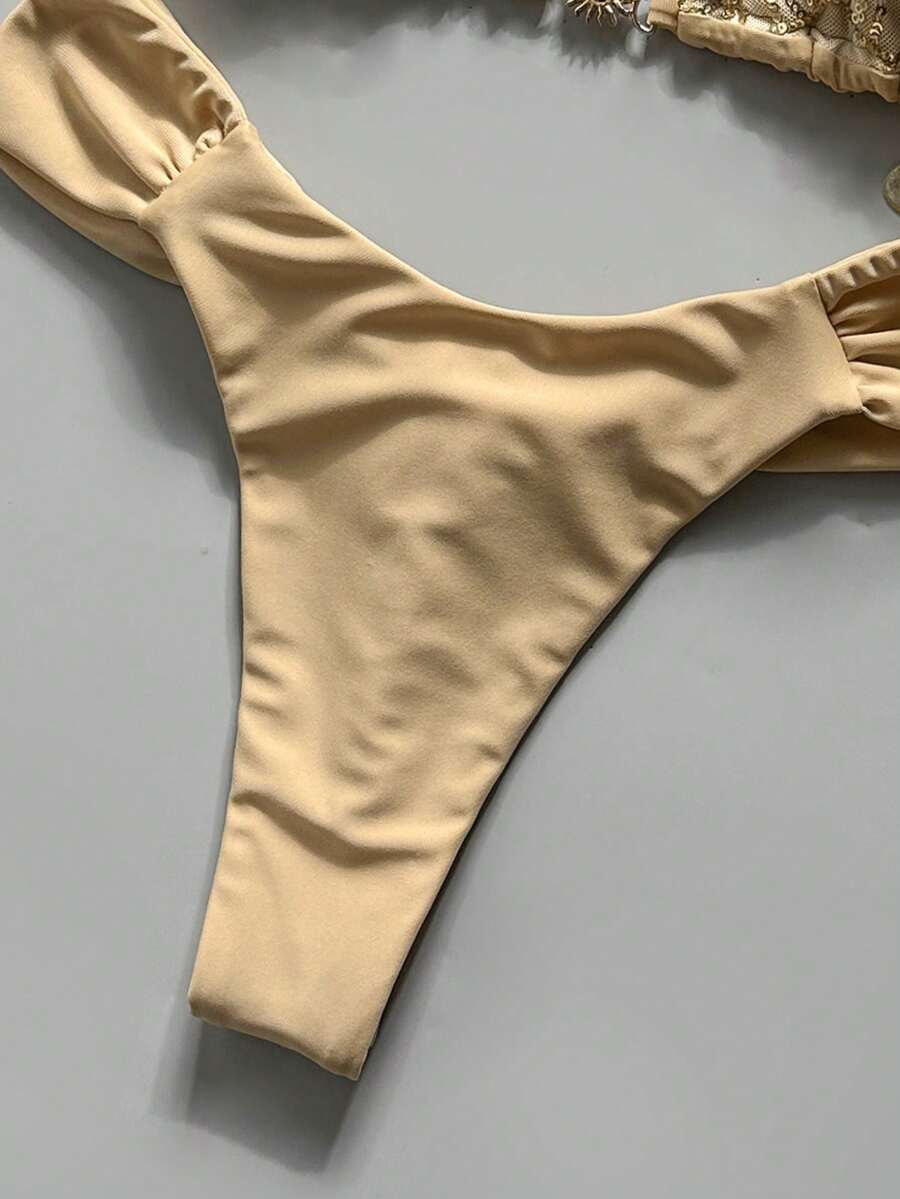 Women's 2-piece triangle cup bikini set in solid color featuring woven pearl shell decoration, halter neckline, and high-waist side-tie ruched bottoms.