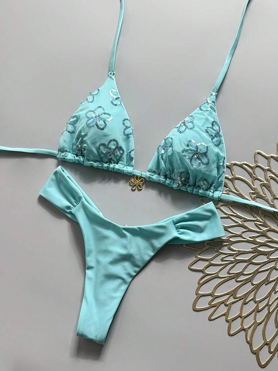 Women's 2-piece triangle cup bikini set in solid color featuring woven pearl shell decoration, halter neckline, and high-waist side-tie ruched bottoms.