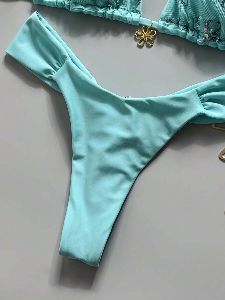 Women's 2-piece triangle cup bikini set in solid color featuring woven pearl shell decoration, halter neckline, and high-waist side-tie ruched bottoms.