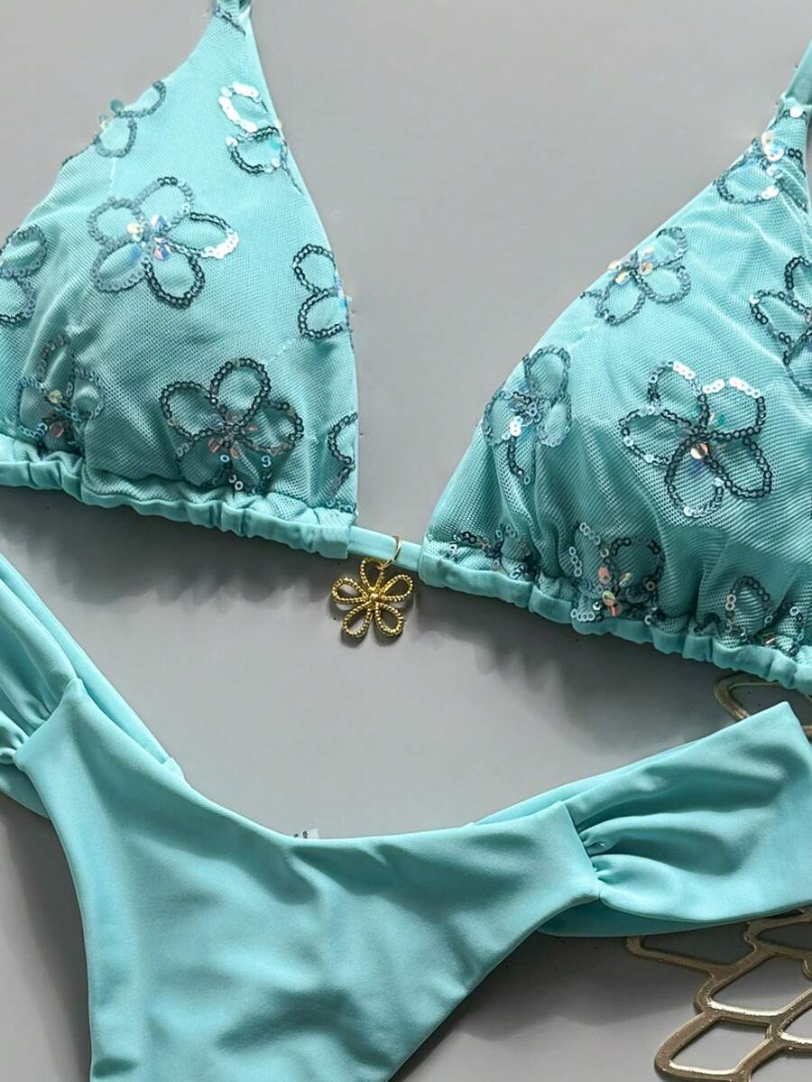 Women's 2-piece triangle cup bikini set in solid color featuring woven pearl shell decoration, halter neckline, and high-waist side-tie ruched bottoms.