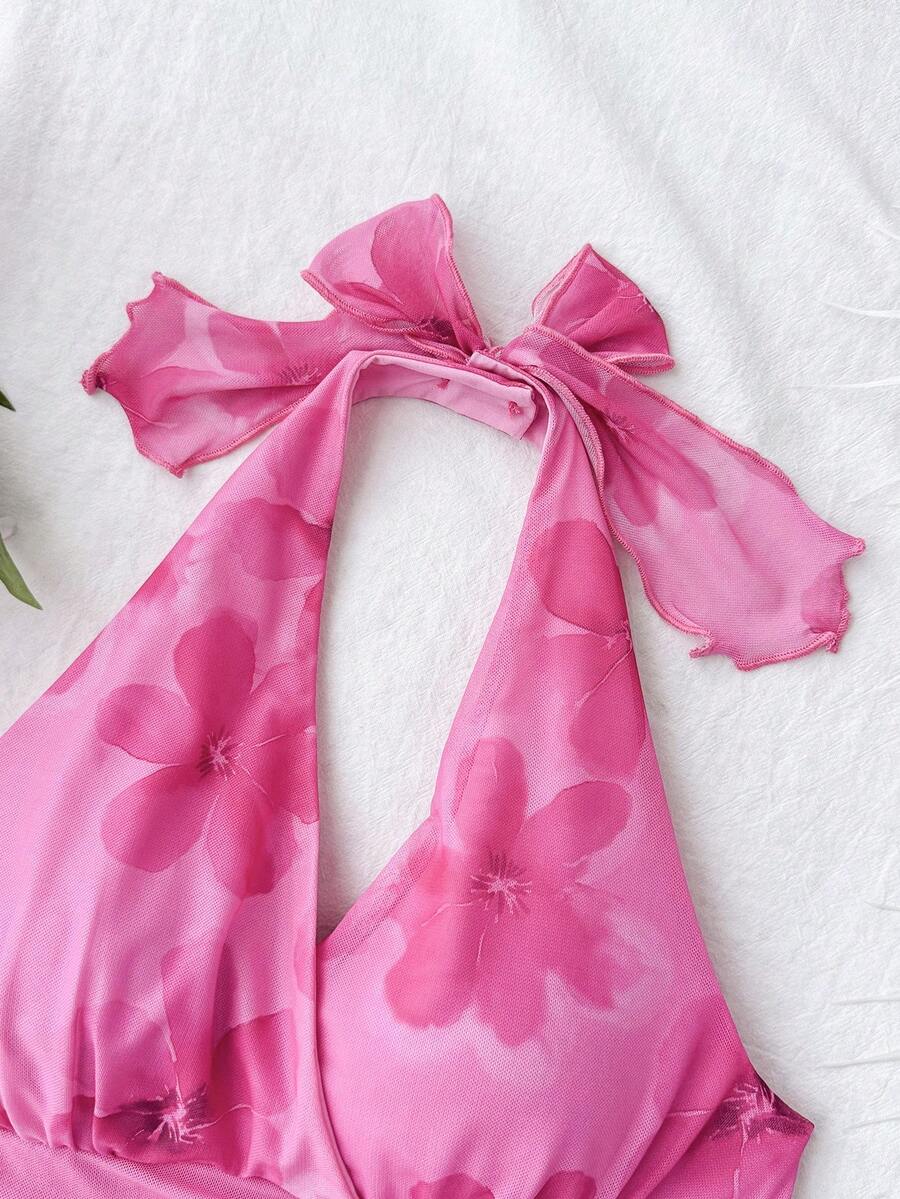 Hot pink tween girls floral print halter dress with sleeveless cami design, high waist, asymmetrical hem, and short slim fit for summer vacation wear