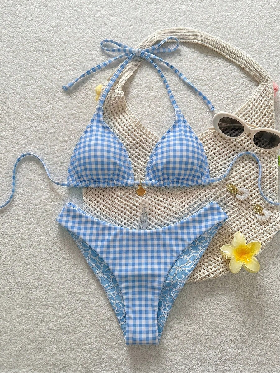 Women's black textured plaid 2-piece bikini set featuring a halter neckline, wireless triangle cups with removable padding, and mid-waist bottoms.