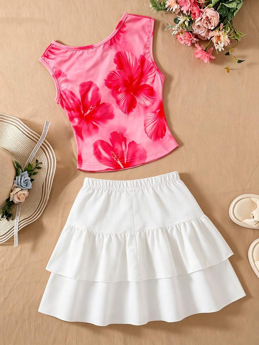 Light blue two-piece outfit set for tween girls with a sleeveless round neck vest top and a tiered ruffle cake skirt featuring a plant pattern.
