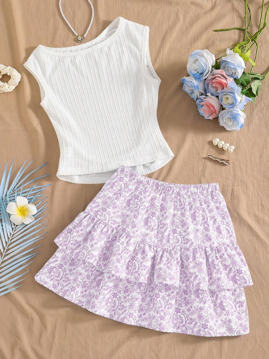 Light blue two-piece outfit set for tween girls with a sleeveless round neck vest top and a tiered ruffle cake skirt featuring a plant pattern.