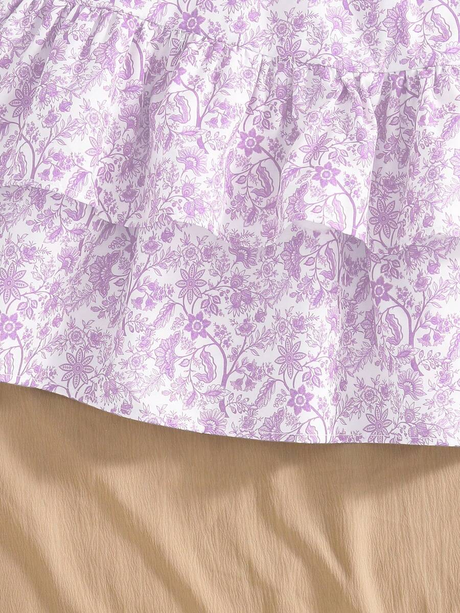 Light blue two-piece outfit set for tween girls with a sleeveless round neck vest top and a tiered ruffle cake skirt featuring a plant pattern.