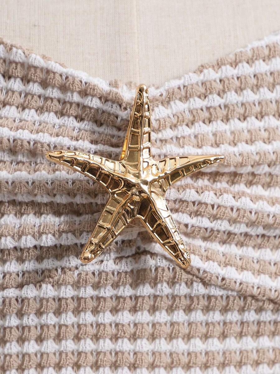 Tween girls apricot sleeveless halter mini dress with textured starfish and shell decor, shirred tiered layer, high waist, and flounce hem.