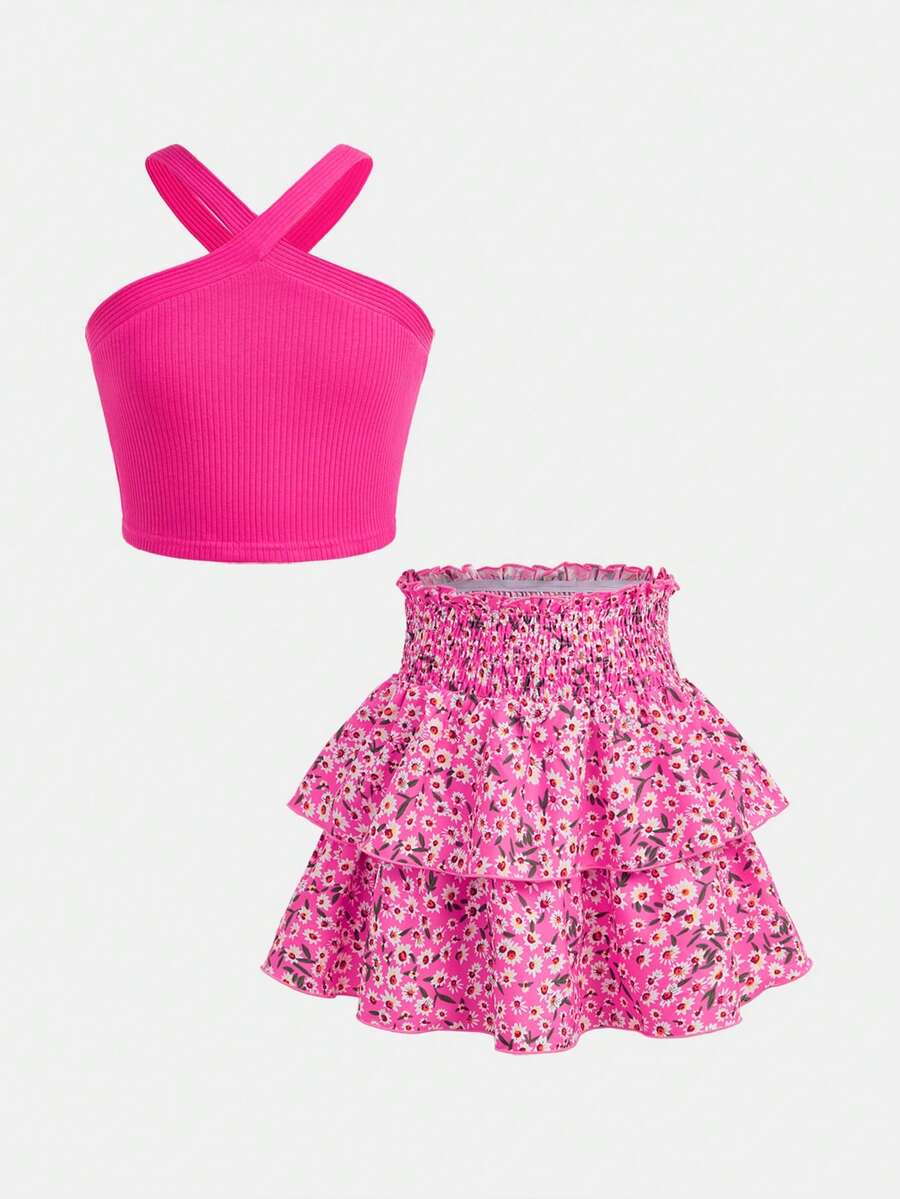 Tween girls blue and white 2-piece set with a striped halter neck vest top and a floral high-waist tiered paperbag skirt.