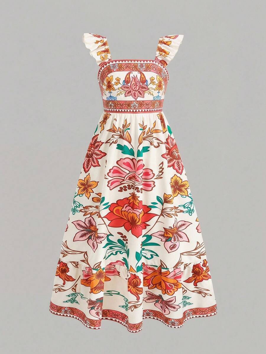 Blue floral print long vacation dress for tween girls featuring an A-line high waist silhouette with ruffle details and spaghetti straps.