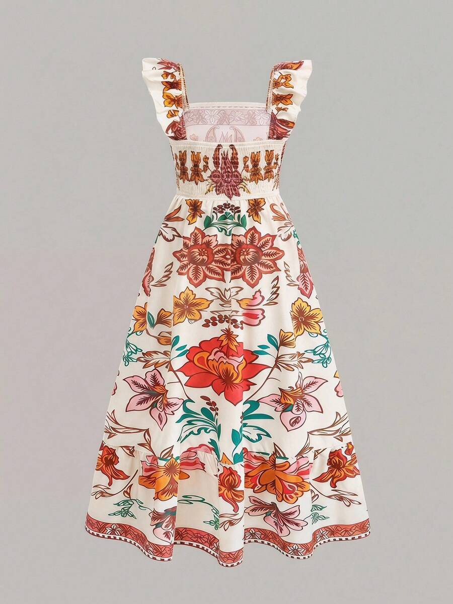Blue floral print long vacation dress for tween girls featuring an A-line high waist silhouette with ruffle details and spaghetti straps.