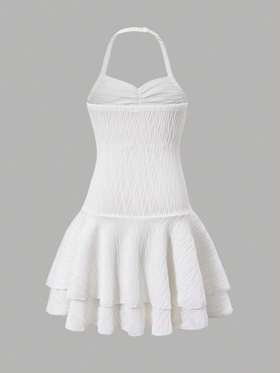 Tween girls apricot sleeveless halter mini dress with textured starfish and shell decor, shirred tiered layer, high waist, and flounce hem.
