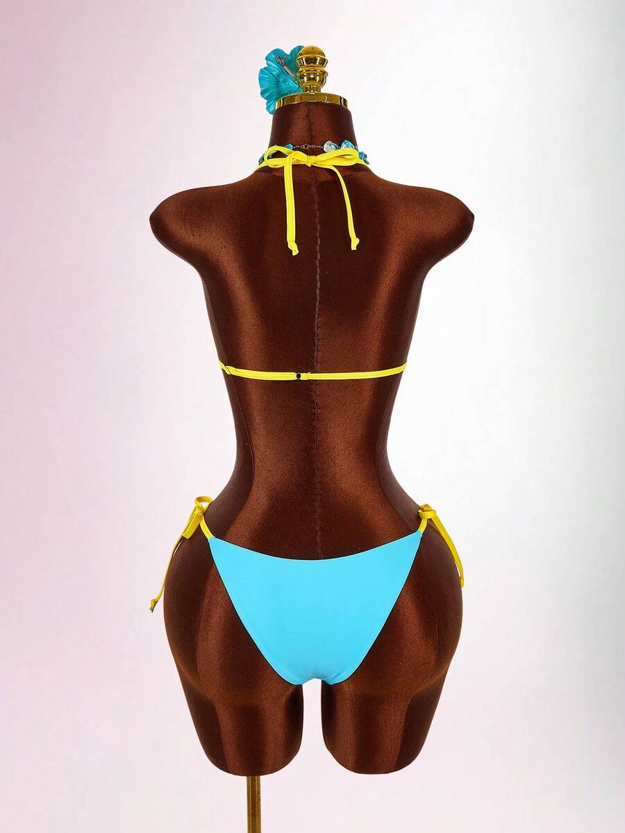 Blue 3-piece women's swimwear set featuring a 3D rose detailed triangle top with cutout tie closure and matching tie-side thong bottom.
