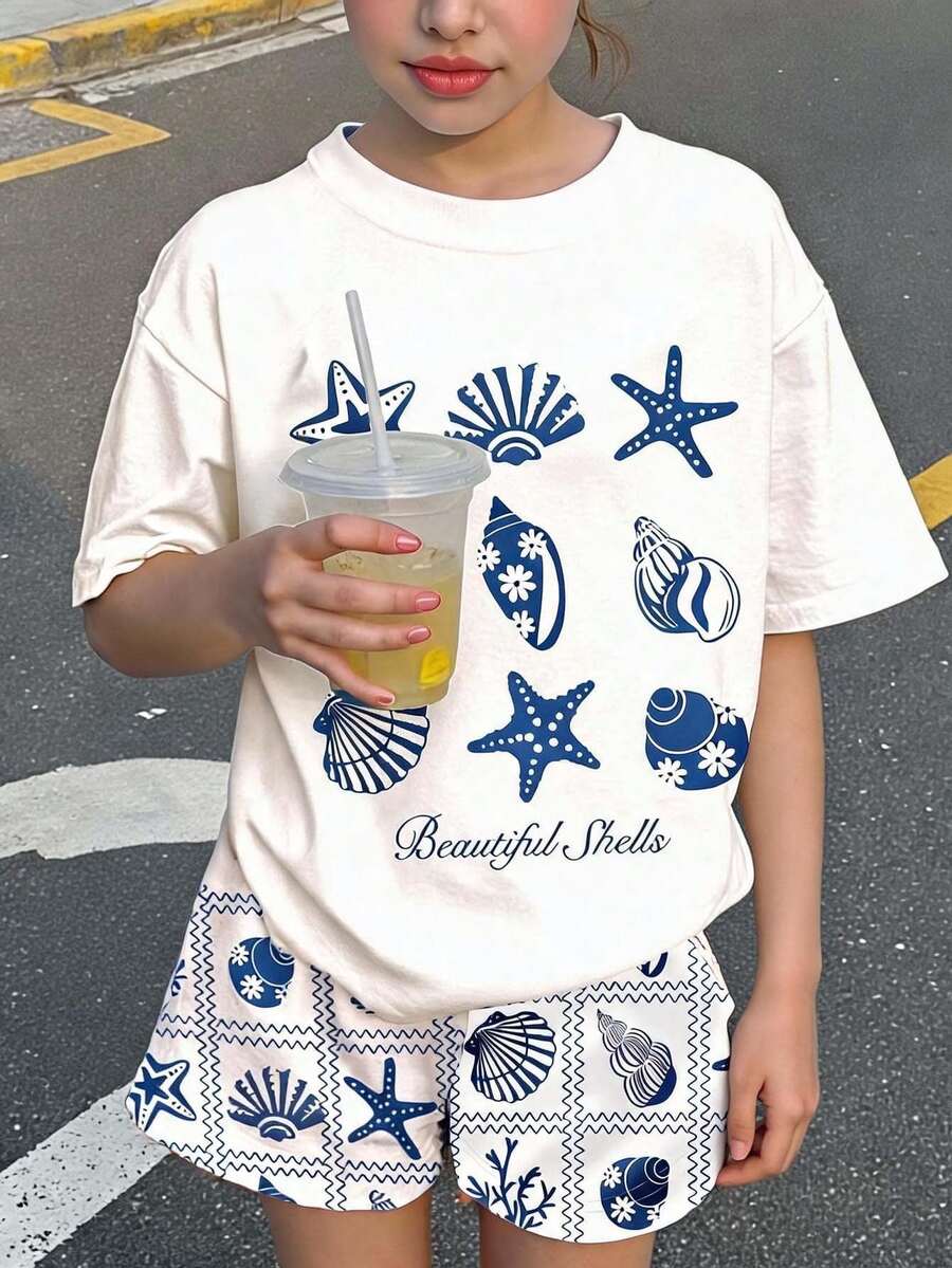 Tween girls 2-piece summer casual outfit featuring a multicolor seashell print short sleeve T-shirt with drop shoulders and matching loose fit shorts with pockets.