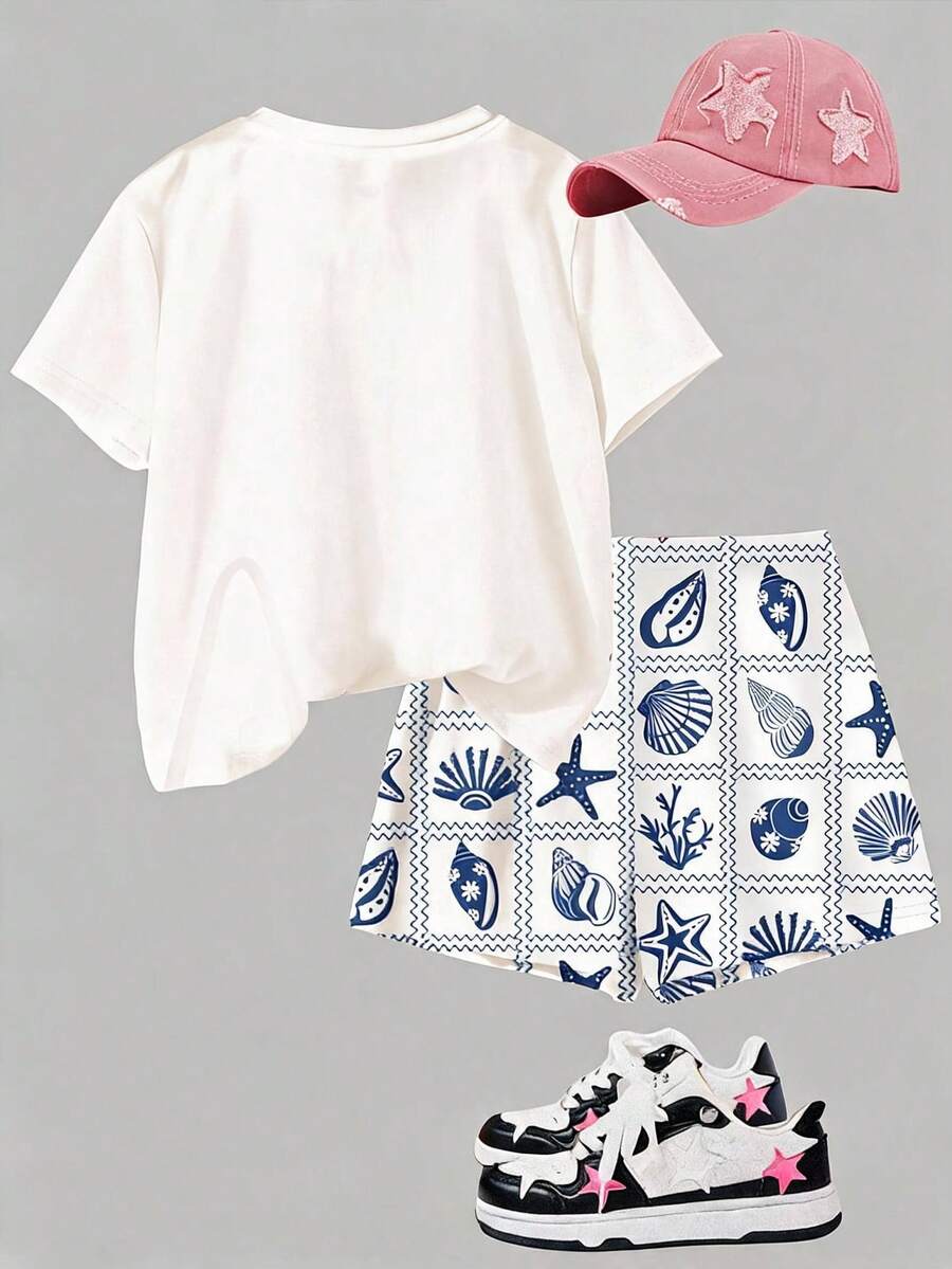 Tween girls 2-piece summer casual outfit featuring a multicolor seashell print short sleeve T-shirt with drop shoulders and matching loose fit shorts with pockets.