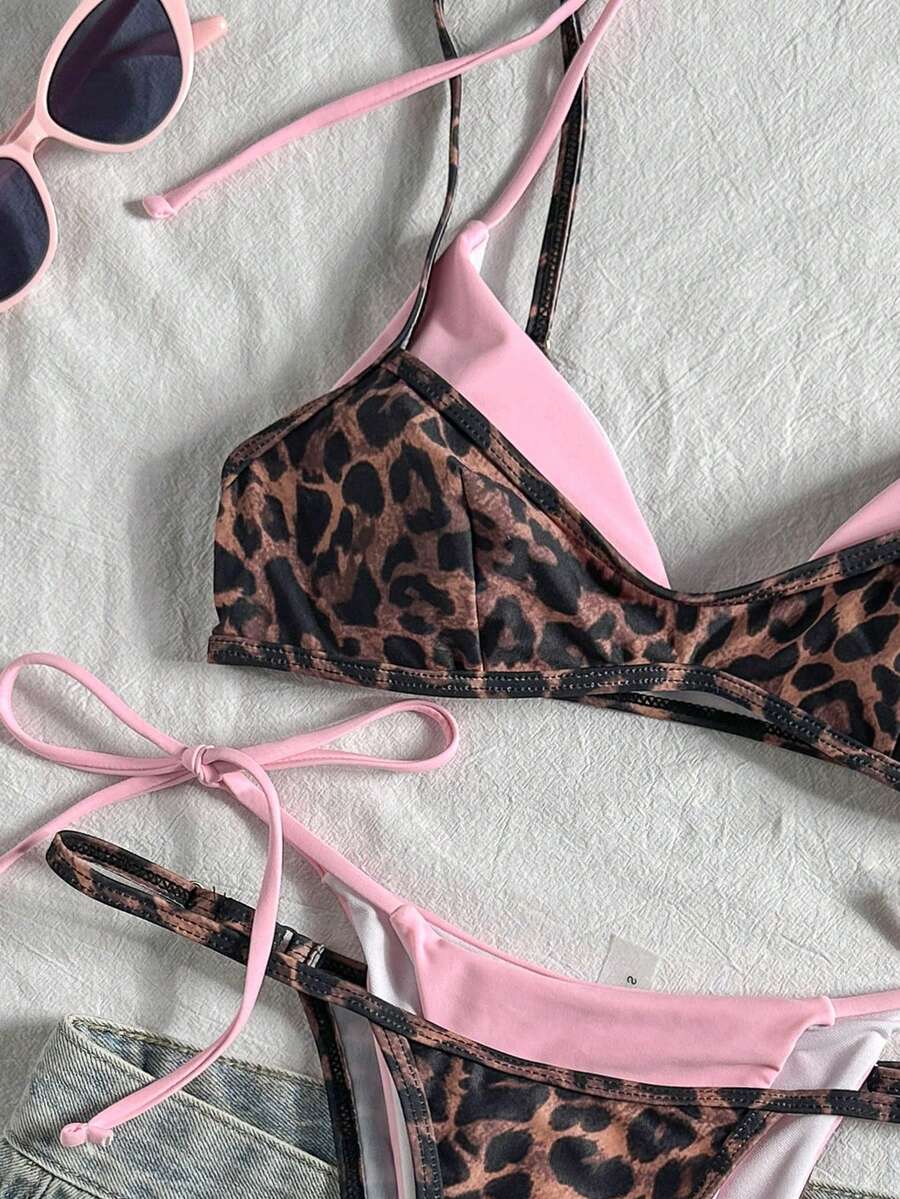 Women's retro polka dot high waist bikini swimsuit set with spaghetti straps and knot tie-back top.