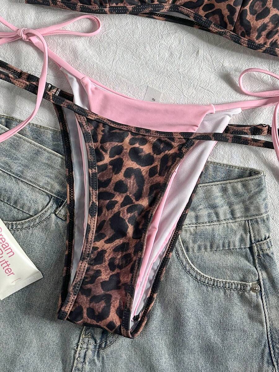 Women's retro polka dot high waist bikini swimsuit set with spaghetti straps and knot tie-back top.