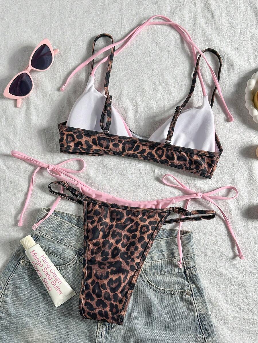 Women's retro polka dot high waist bikini swimsuit set with spaghetti straps and knot tie-back top.