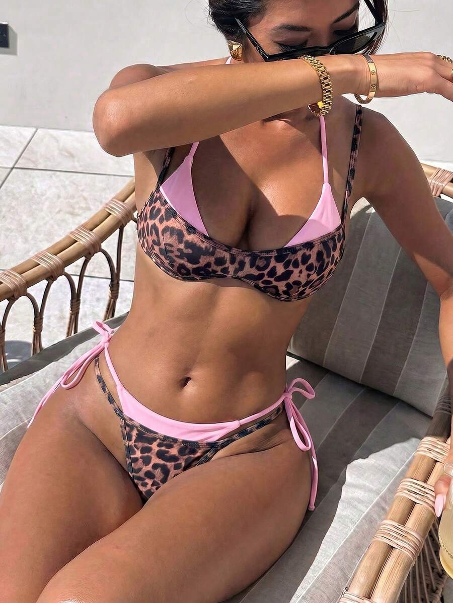 Women's retro polka dot high waist bikini swimsuit set with spaghetti straps and knot tie-back top.