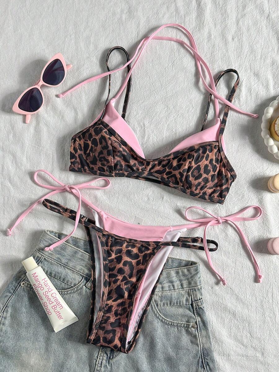 Women's retro polka dot high waist bikini swimsuit set with spaghetti straps and knot tie-back top.