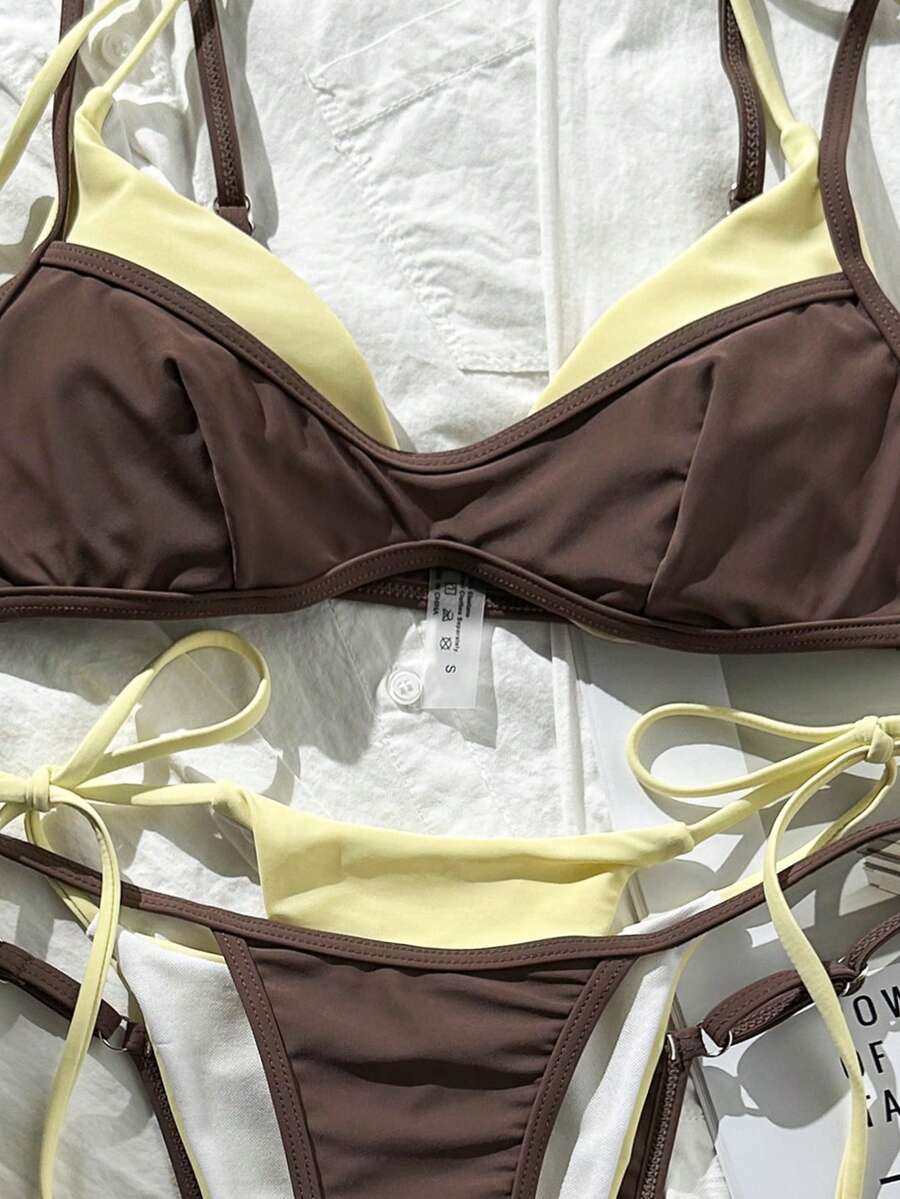 Women's retro polka dot high waist bikini swimsuit set with spaghetti straps and knot tie-back top.