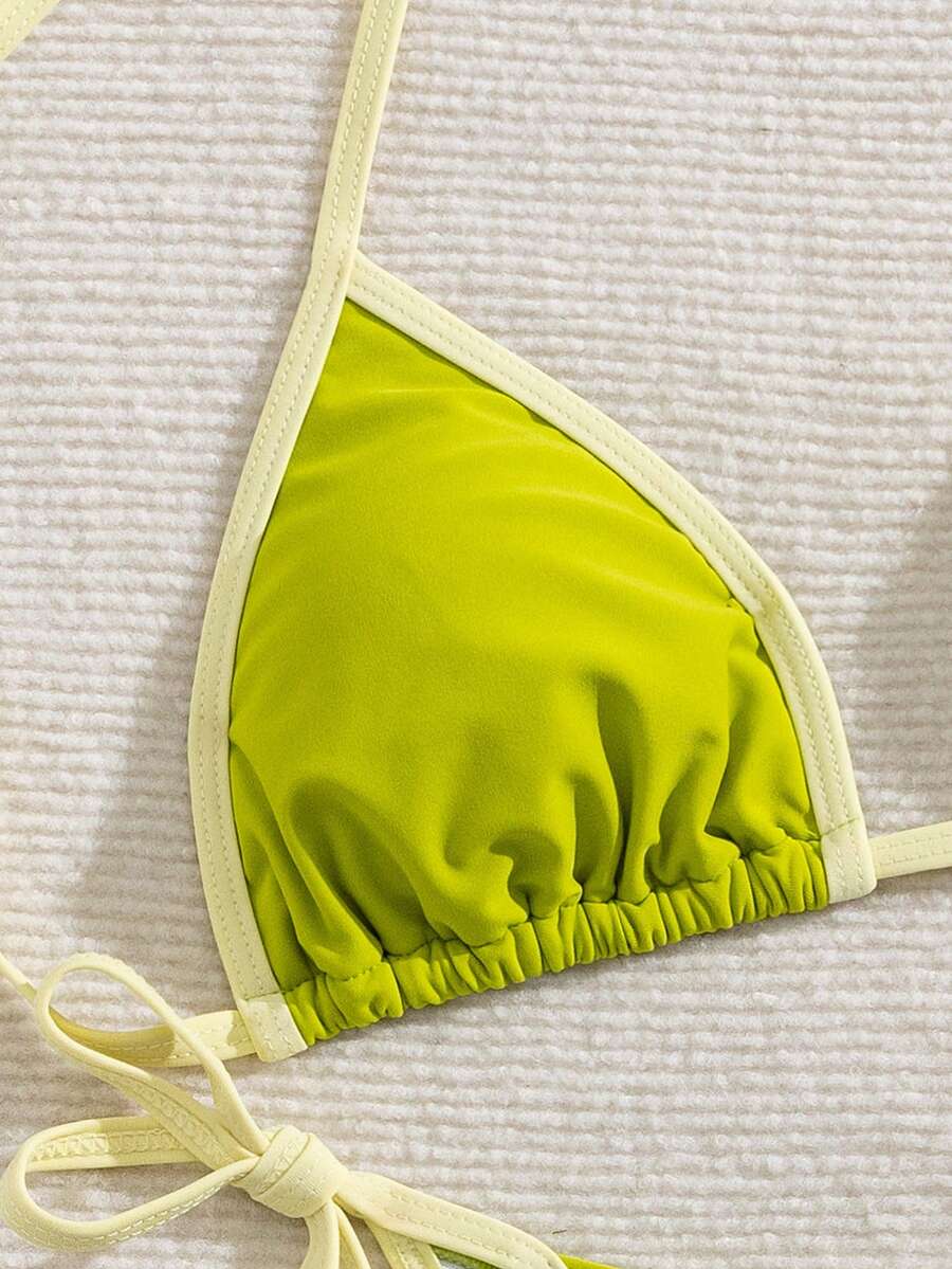 Women's two-piece halter triangle bikini set featuring a backless tie-back top with removable padding and matching tie-side mid-waist bottoms.