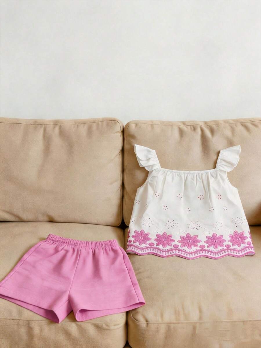 Tween girls 2-piece bohemian outfit set in apricot featuring a square neck embroidered sleeveless camisole top and matching floral wide leg shorts.