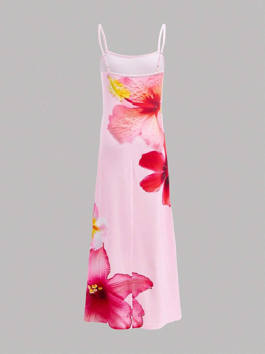 Tween girls black cami midi dress featuring plant print, spaghetti straps, slim fit, and a flared hem.