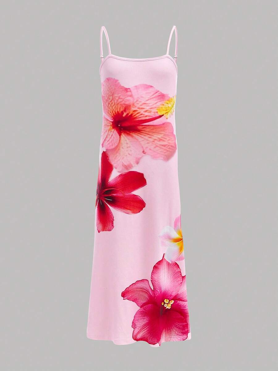 Tween girls black cami midi dress featuring plant print, spaghetti straps, slim fit, and a flared hem.