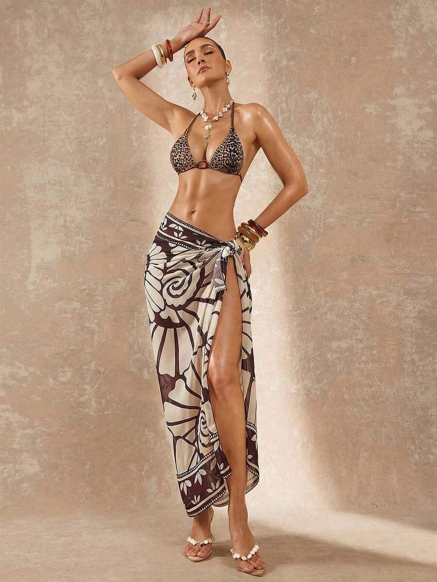 Women's black and white halter triangle bikini top and high waist tie side thong bottoms set.