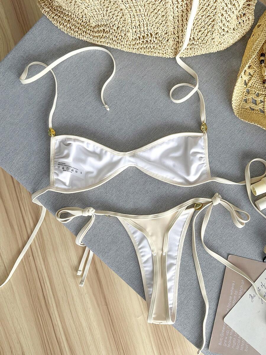 Apricot 2-piece sequin textured halter bikini set featuring a wireless top with lace-up backless ties and matching low-waist side-tie thong bottoms.