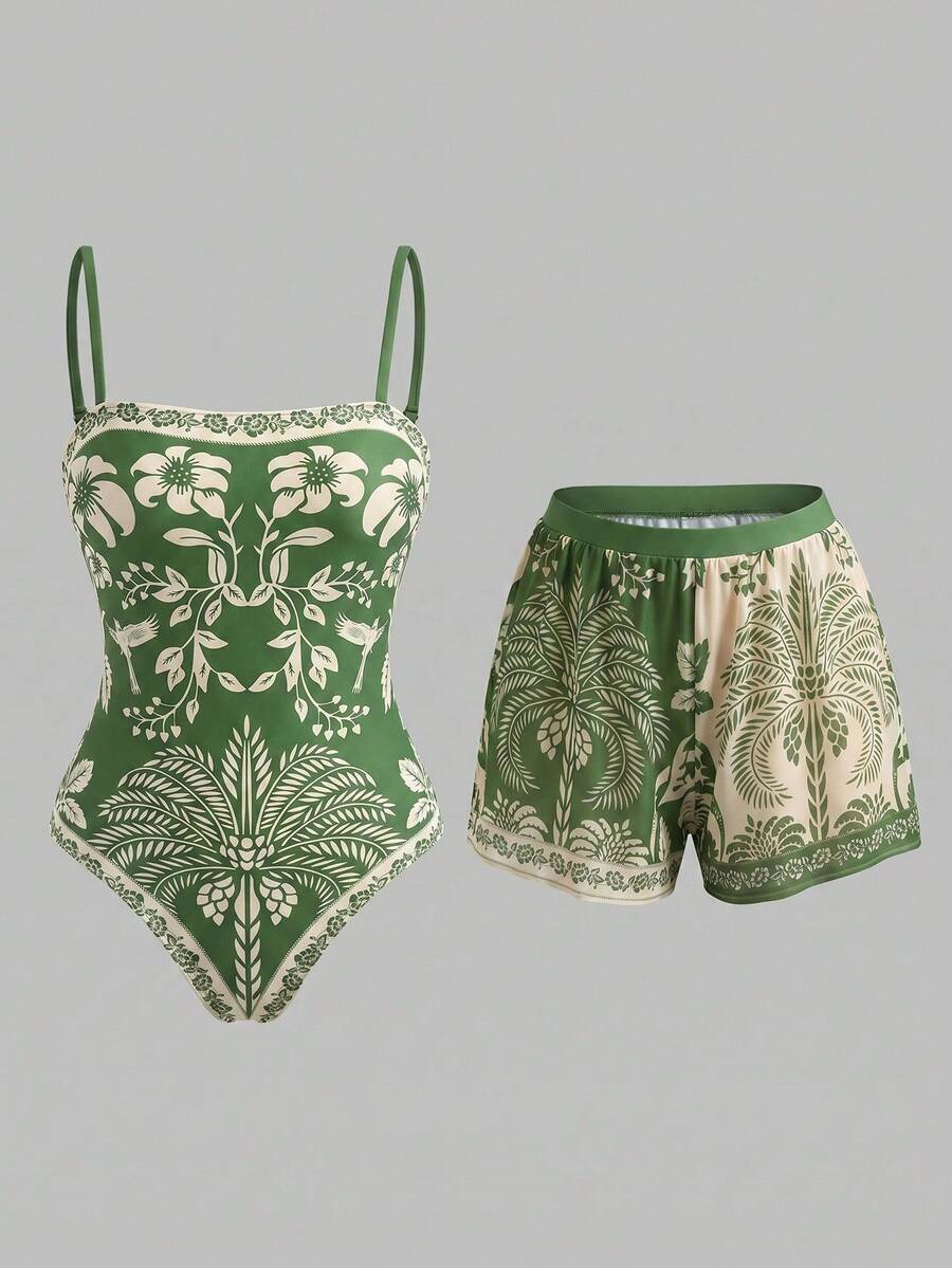 Swim Oasis women's tropical palm tree print army green one-piece swimsuit featuring spaghetti straps, removable padding, and matching shorts for beach vacations.