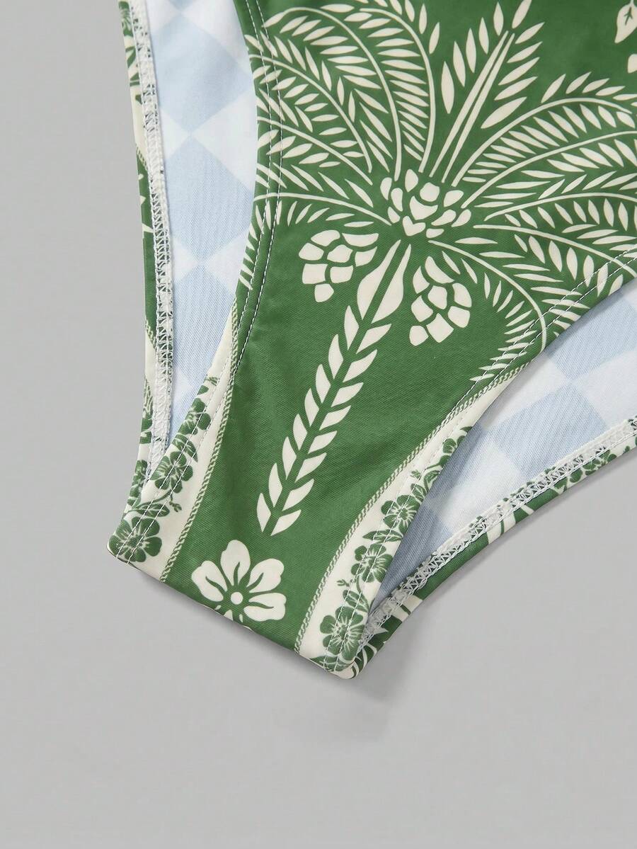 Swim Oasis women's tropical palm tree print army green one-piece swimsuit featuring spaghetti straps, removable padding, and matching shorts for beach vacations.