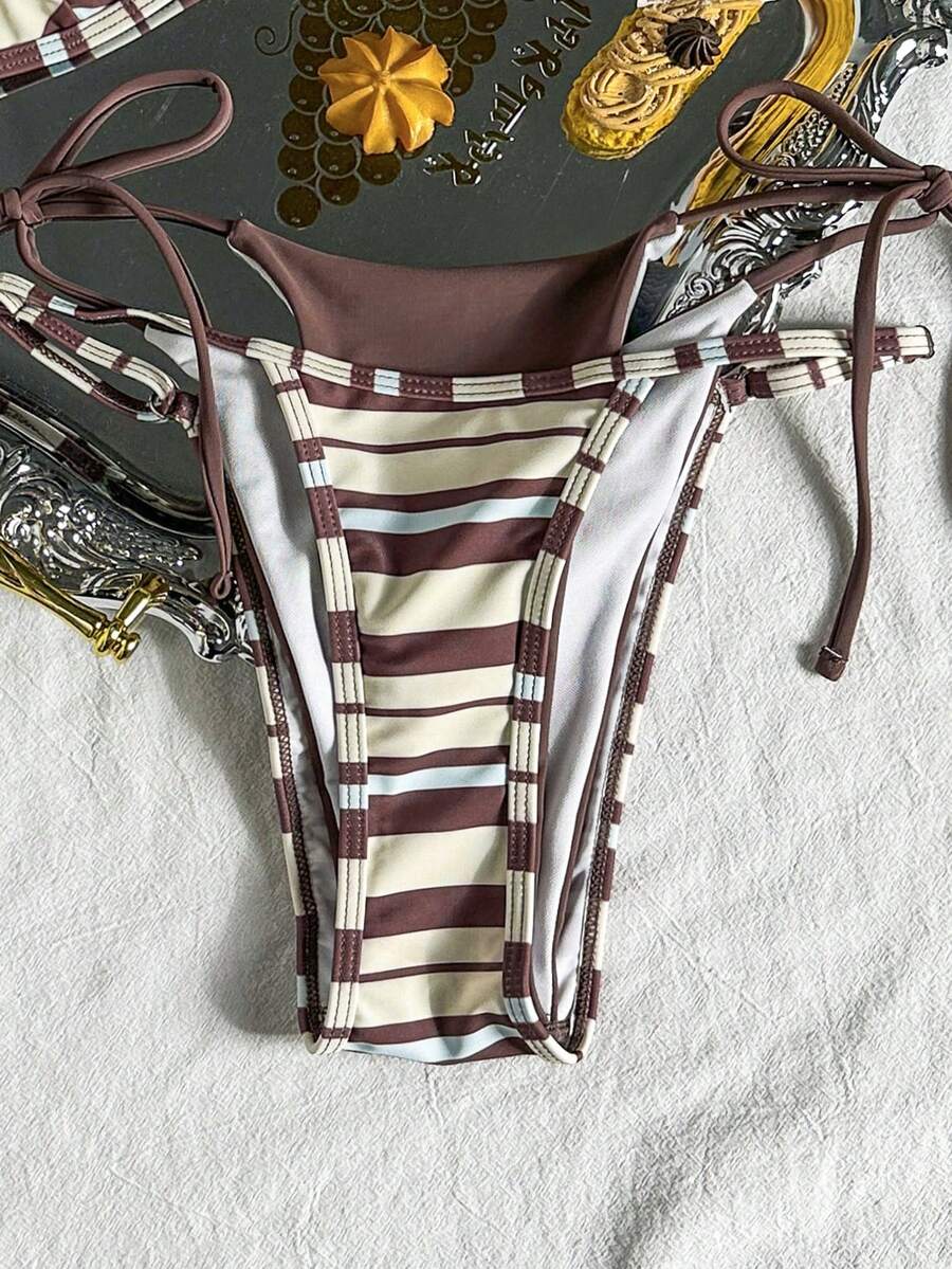 Women's retro polka dot high waist bikini swimsuit set with spaghetti straps and knot tie-back top.